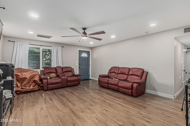 13039 N 19th Ave, Phoenix, AZ 85029 - living room with ceiling fan, light wood-style flooring, baseboards, and recessed lighting