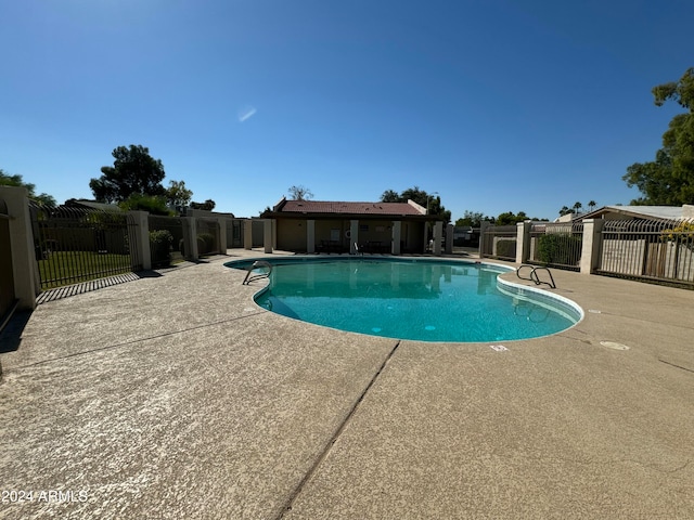 view of pool featuring a patio area