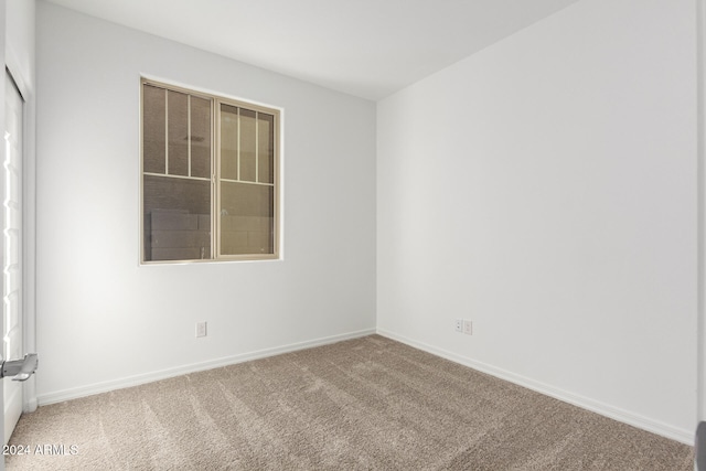 spare room with carpet flooring