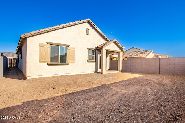 rear view of property with a patio