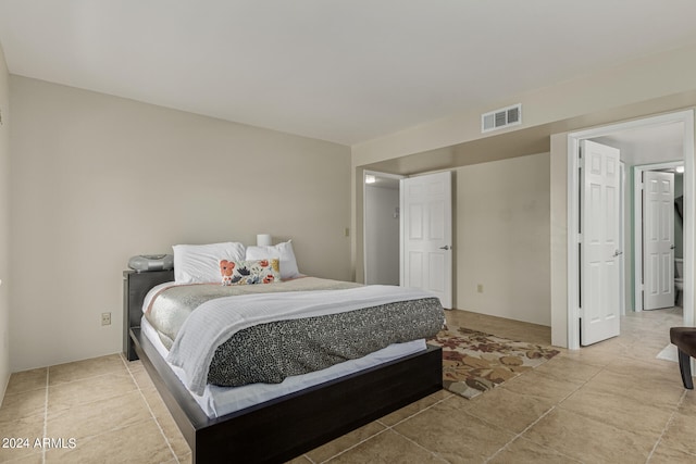 bedroom featuring light tile flooring