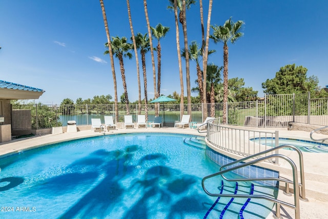 view of swimming pool with a patio