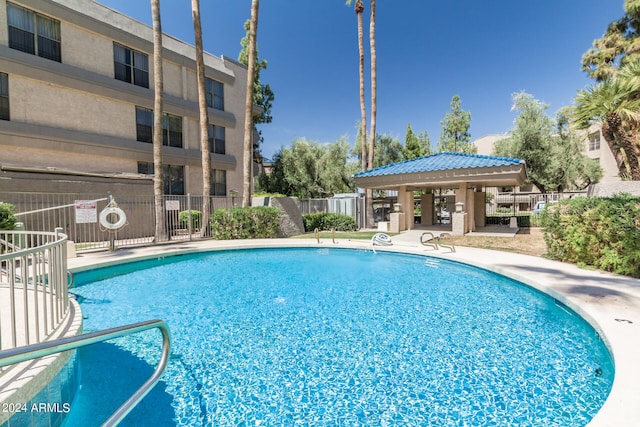 view of swimming pool with a patio area