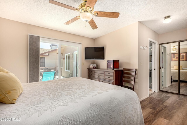 bedroom featuring a textured ceiling, a ceiling fan, wood finished floors, and access to exterior