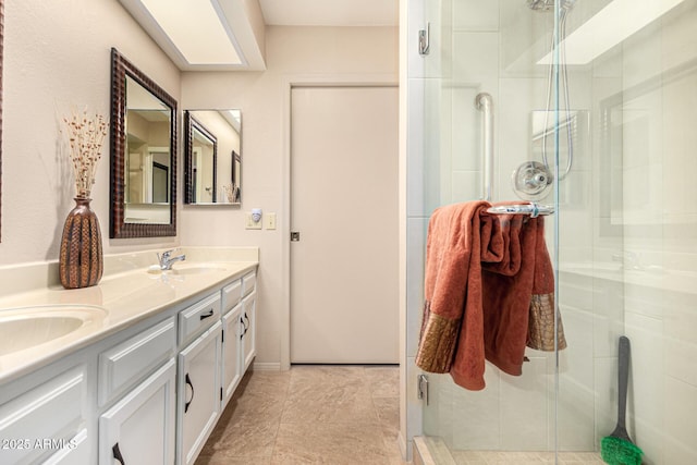 bathroom with double vanity, a sink, and a stall shower