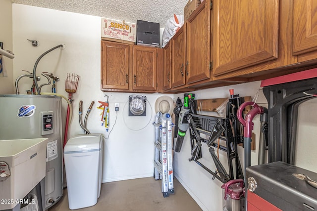 laundry area featuring water heater