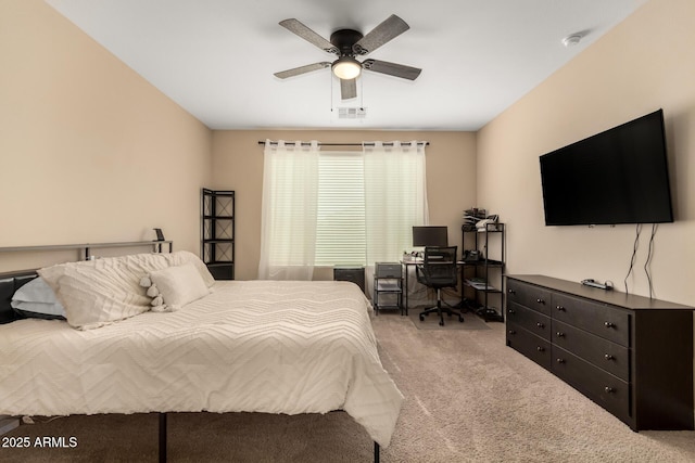 bedroom featuring ceiling fan and light carpet