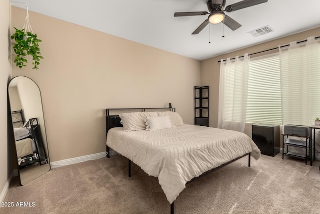 bedroom with ceiling fan and carpet flooring