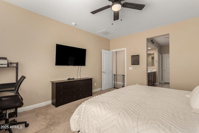 carpeted bedroom with ceiling fan and connected bathroom