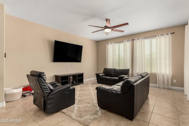 living room with ceiling fan and light tile patterned flooring