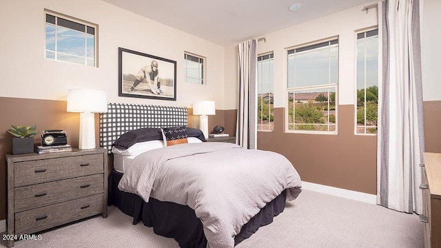 bedroom with light colored carpet