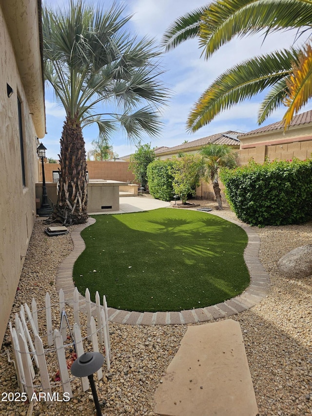 14380 W Monte Vista Rd, Goodyear, AZ 85395 - fenced backyard with a patio area