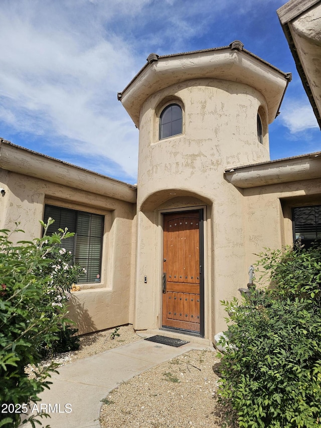 14380 W Monte Vista Rd, Goodyear, AZ 85395 - doorway to property with stucco siding