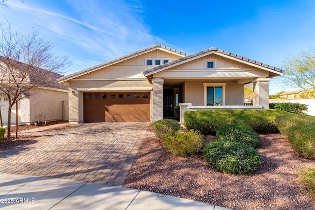 craftsman-style home featuring a garage and a porch