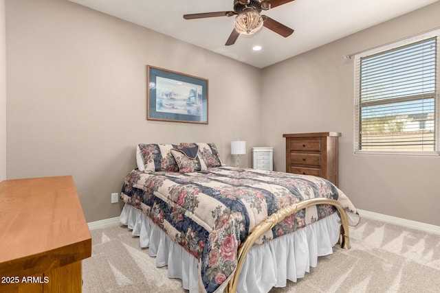 bedroom featuring light carpet and ceiling fan