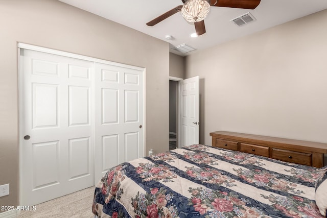 carpeted bedroom with a closet and ceiling fan