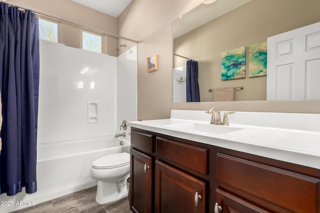 full bathroom with vanity, toilet, shower / tub combo, and hardwood / wood-style floors