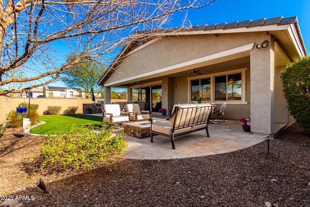 back of property with a patio, an outdoor living space with a fire pit, and ceiling fan