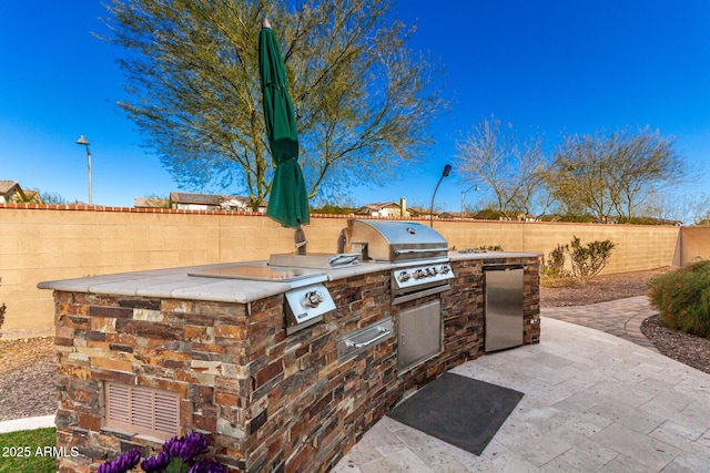 view of patio featuring area for grilling and grilling area