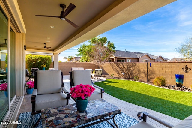 view of patio featuring ceiling fan