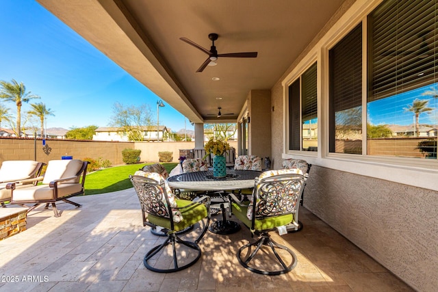 view of patio / terrace featuring ceiling fan