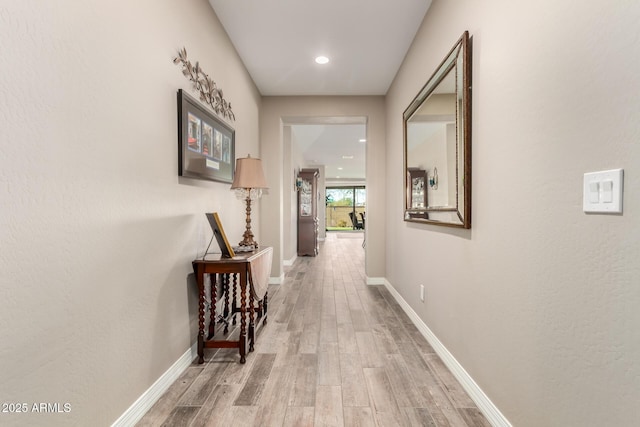 hallway featuring light wood-type flooring