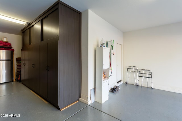 garage featuring stainless steel fridge