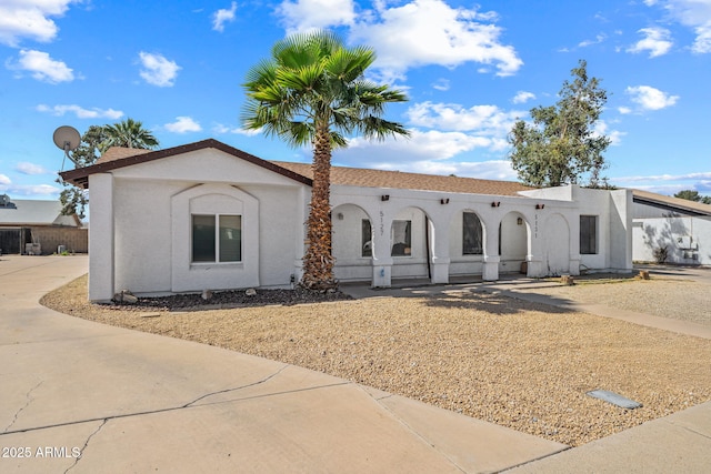 view of front of house featuring stucco siding