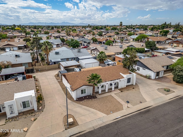 birds eye view of property with a mountain view and a residential view