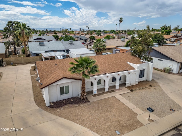 birds eye view of property with a residential view
