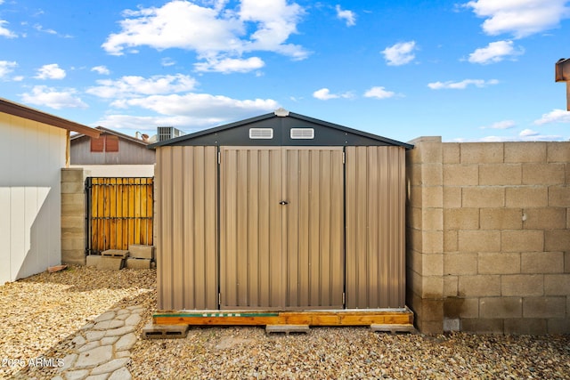 view of shed with a fenced backyard