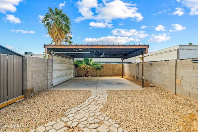 exterior space with a carport and a fenced backyard