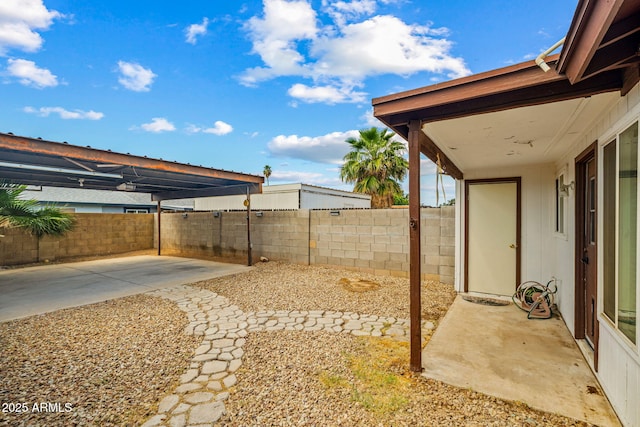 view of yard with a patio area and a fenced backyard