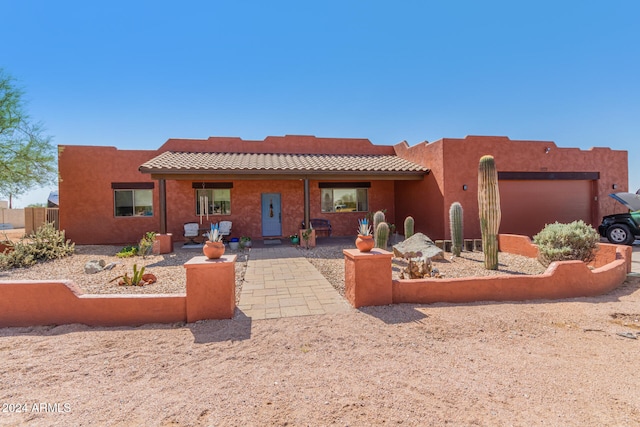 rear view of house featuring a patio