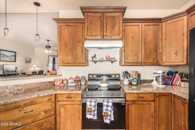 kitchen with hanging light fixtures, stainless steel range with electric stovetop, light stone countertops, and ceiling fan