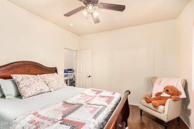 bedroom with ceiling fan and dark hardwood / wood-style floors