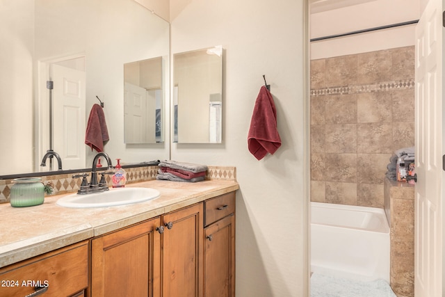 bathroom featuring a bath and vanity