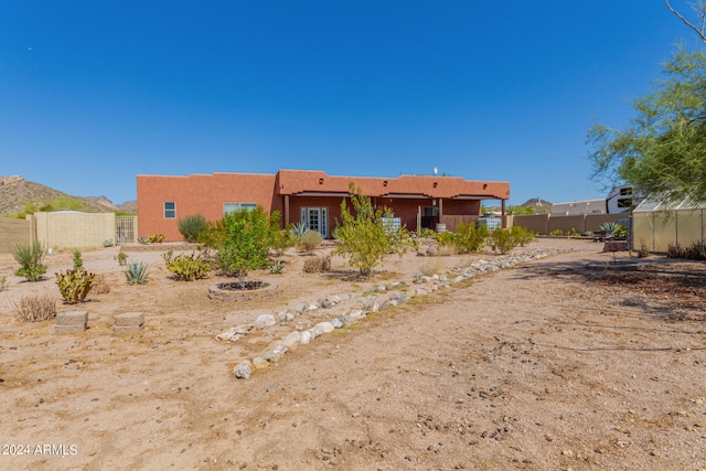 back of house featuring a mountain view