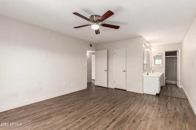 4722 W Via Cynthia, Glendale, AZ 85301 - unfurnished bedroom featuring wood finished floors, connected bathroom, and a ceiling fan