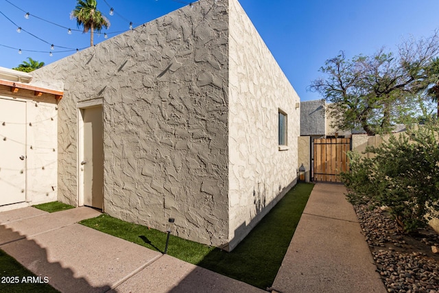 4722 W Via Cynthia, Glendale, AZ 85301 - view of home's exterior featuring a gate and stucco siding