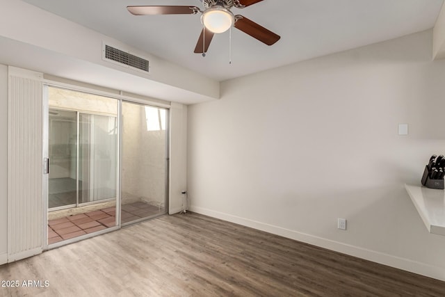 4722 W Via Cynthia, Glendale, AZ 85301 - unfurnished bedroom with wood finished floors and a ceiling fan