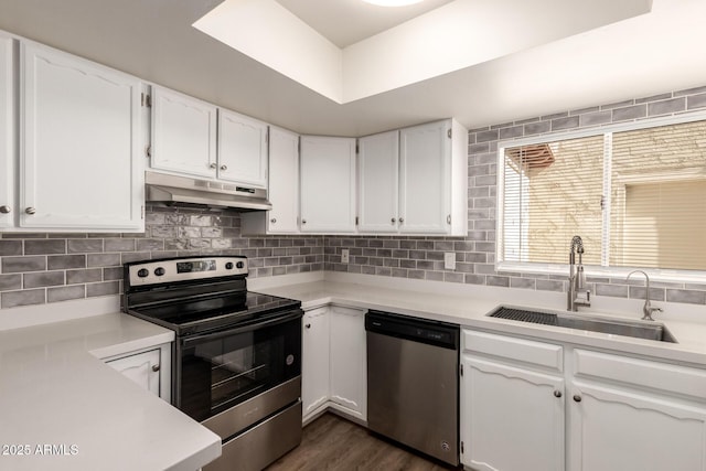 4722 W Via Cynthia, Glendale, AZ 85301 - kitchen with stainless steel appliances, under cabinet range hood, white cabinets, and light countertops