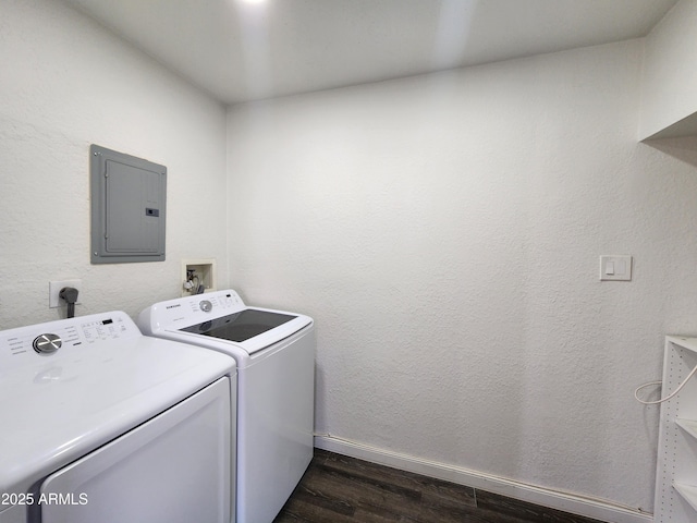 clothes washing area featuring laundry area, electric panel, baseboards, washer and clothes dryer, and dark wood-style flooring