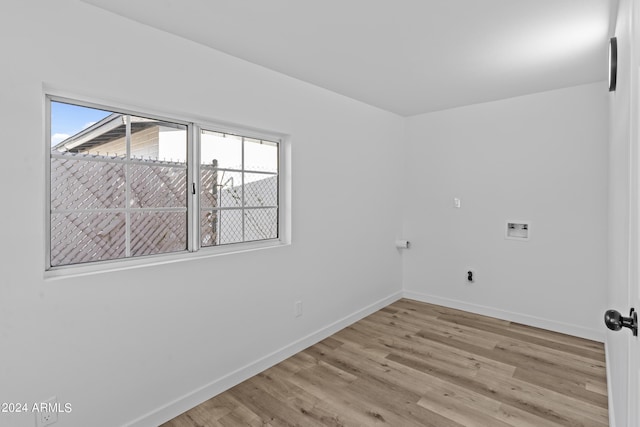 empty room featuring baseboards and wood finished floors