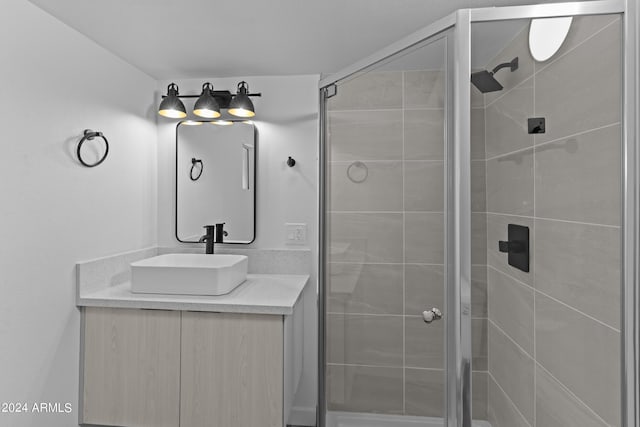 bathroom with vanity and a shower stall