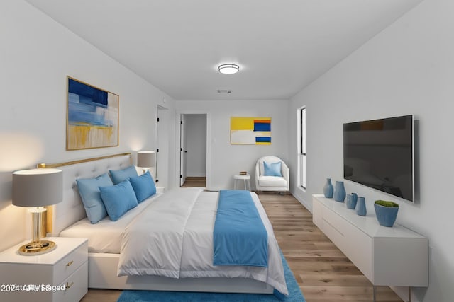 bedroom featuring visible vents and light wood-type flooring