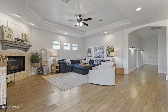 2625 N 24th St Unit 22, Mesa, AZ 85213 - living area with arched walkways, a tray ceiling, ceiling fan, light wood finished floors, and recessed lighting