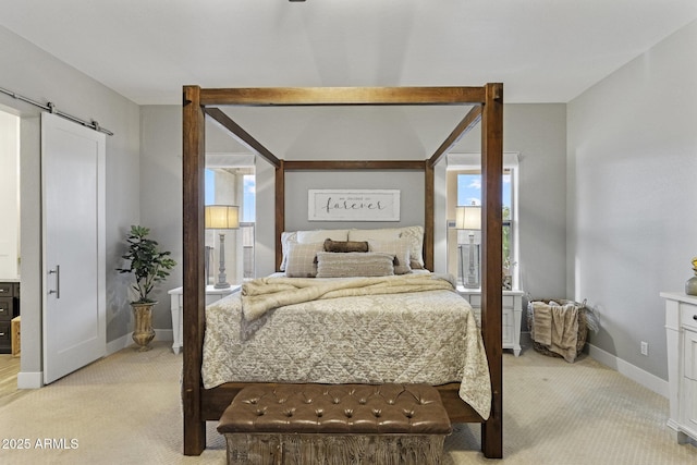 2625 N 24th St Unit 22, Mesa, AZ 85213 - bedroom featuring a barn door, light colored carpet, and baseboards