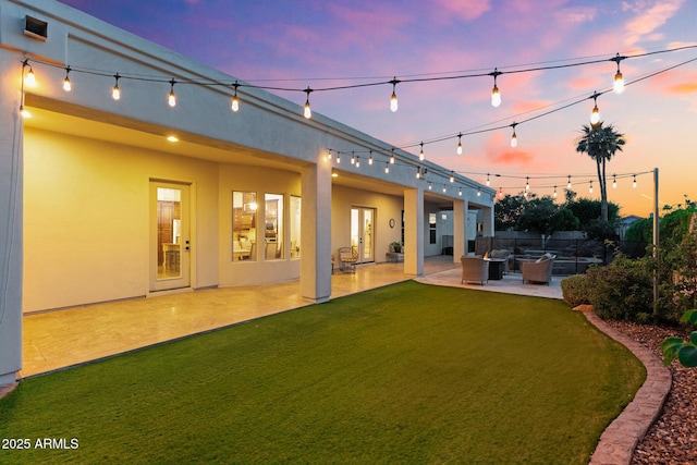 2625 N 24th St Unit 22, Mesa, AZ 85213 - back of house with an outdoor living space, a patio area, and stucco siding