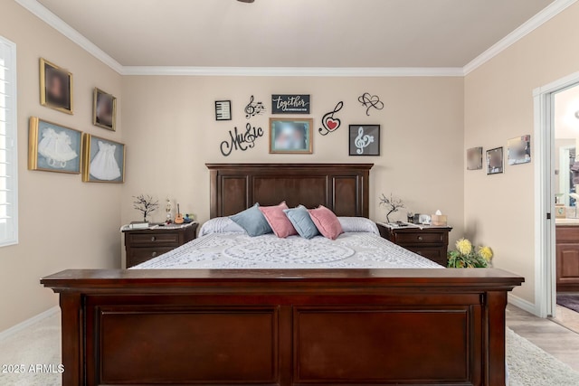 bedroom with ornamental molding, ensuite bath, and baseboards